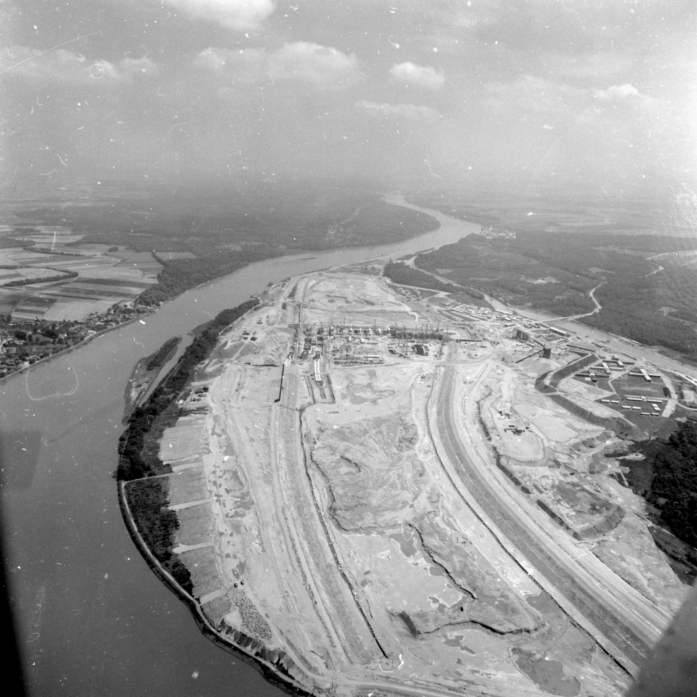 A black-and-white aerial photo of cleared flatland.