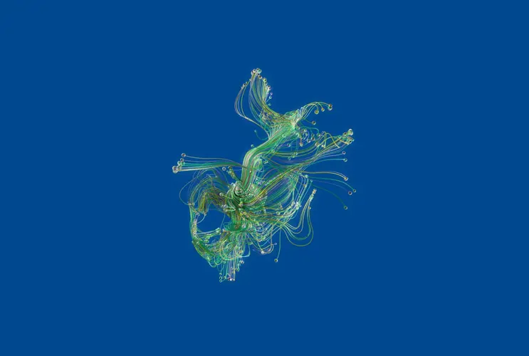 We see an object without a specific shape. It consists of different green strands. It is placed on a dark blue background.